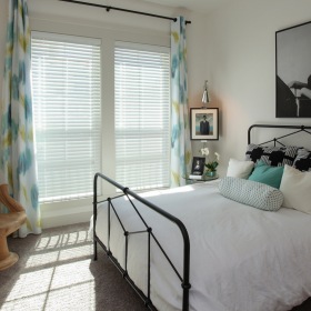 Bedroom large bedroom window provides ample natural lighting